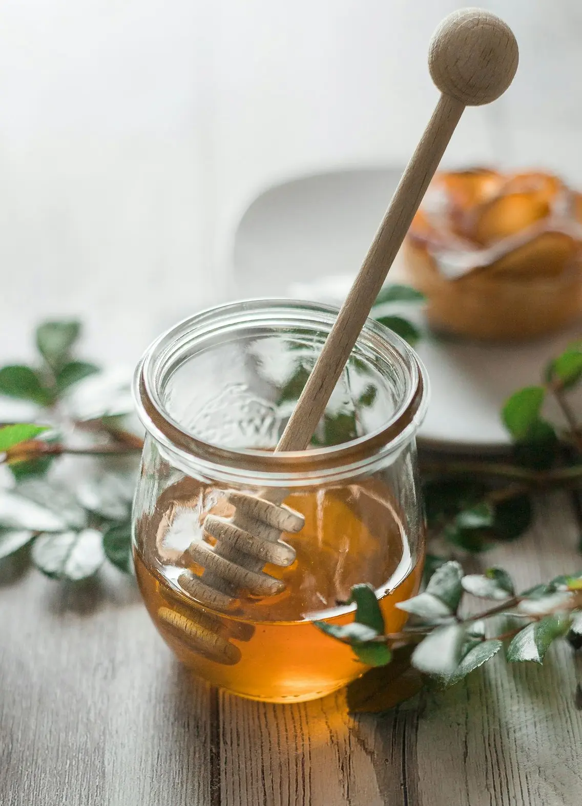 clear glass jar with orange liquid